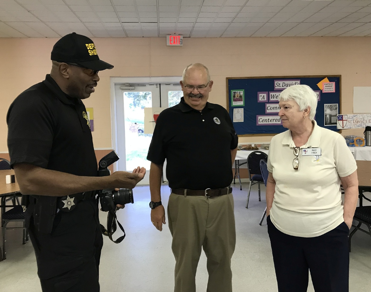 First Responders Police photographer Coop Cooper and Mary Finch talking 3571