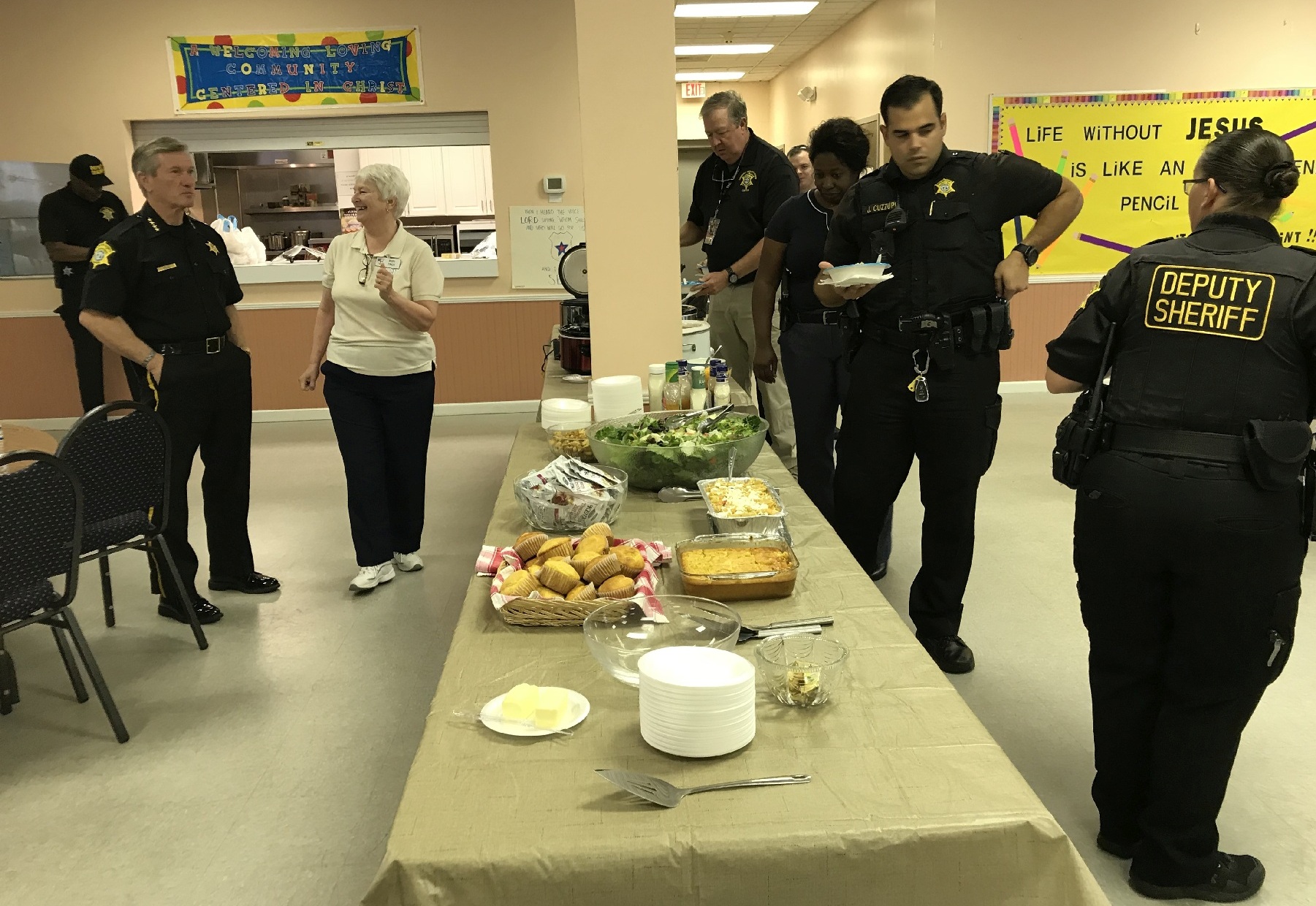 First Responders Seheriff Lott and Mary talking as the buffet opens to deputy wheriffs 3588